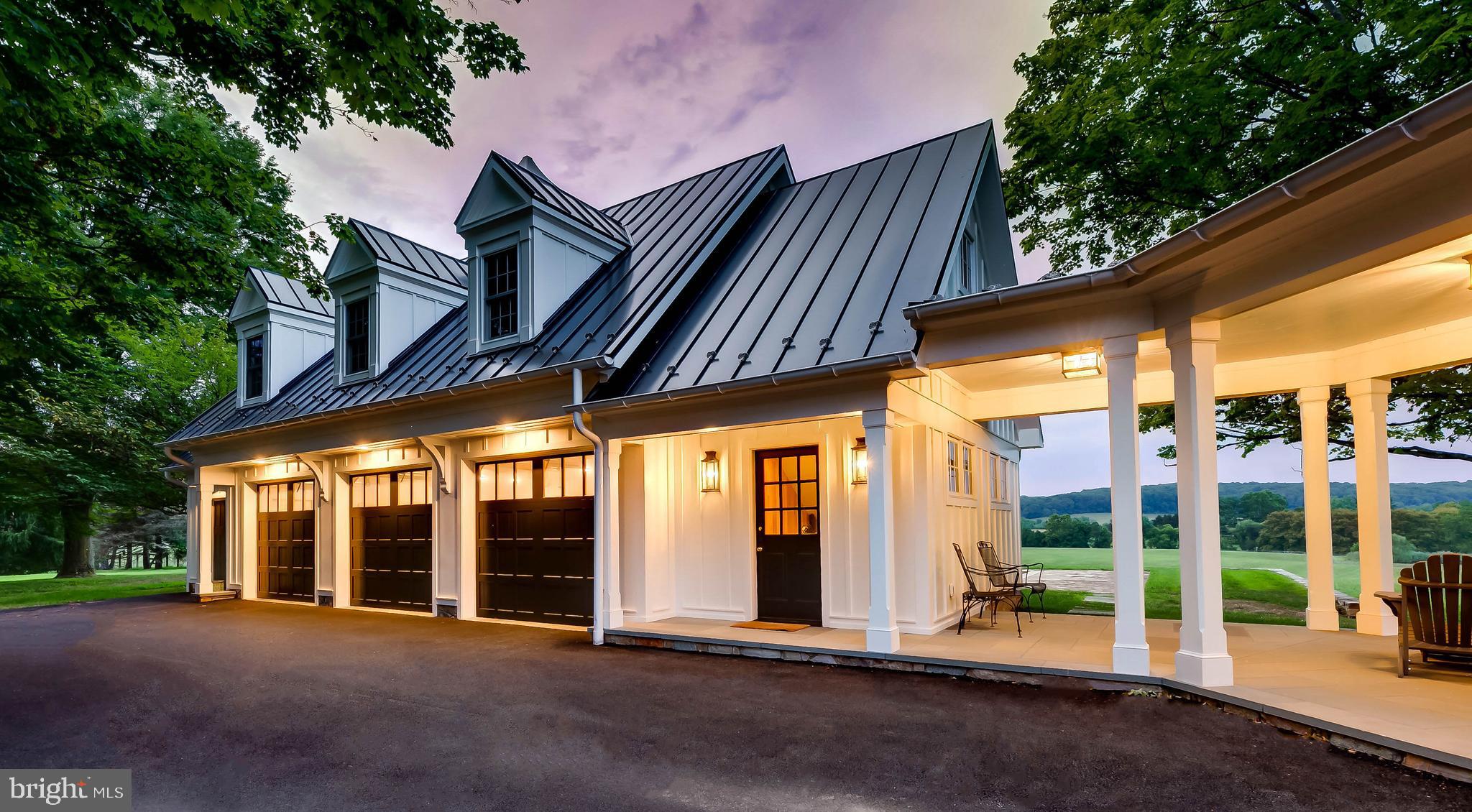 13401 Longnecker Road Reisterstown, MD 21136 - Photo 18 of 58 a view of a building with a large window and wooden fence