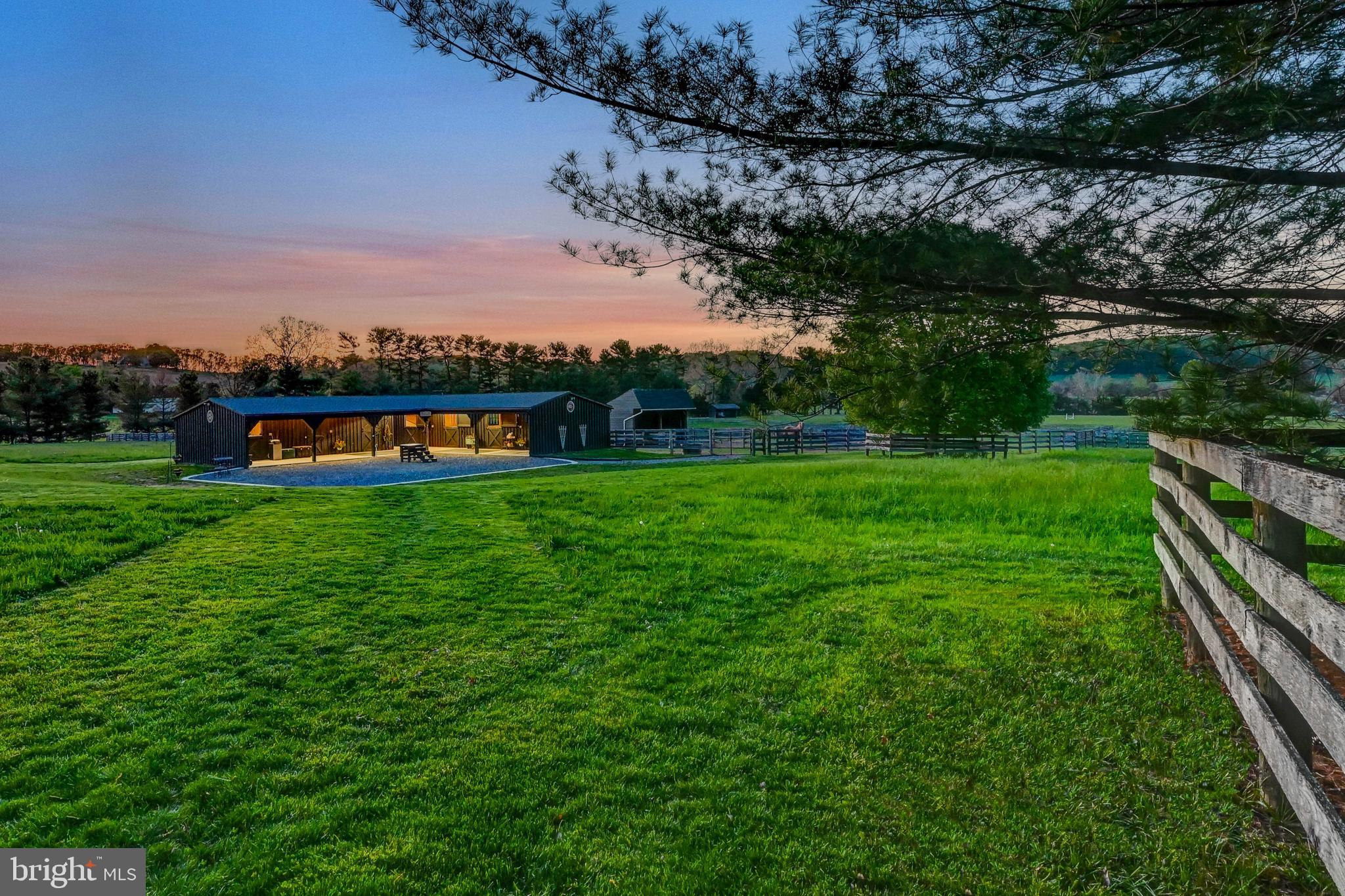 13401 Longnecker Road Reisterstown, MD 21136 - Photo 24 of 58 a view of a lake with a houses in the back