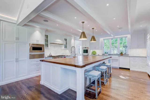 a aerial view of a house with pool yard and outdoor seating