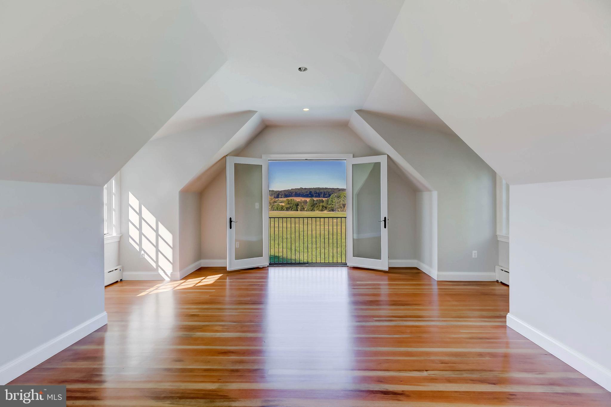 13401 Longnecker Road Reisterstown, MD 21136 - Photo 34 of 58 a view of an empty room with wooden floor and a window