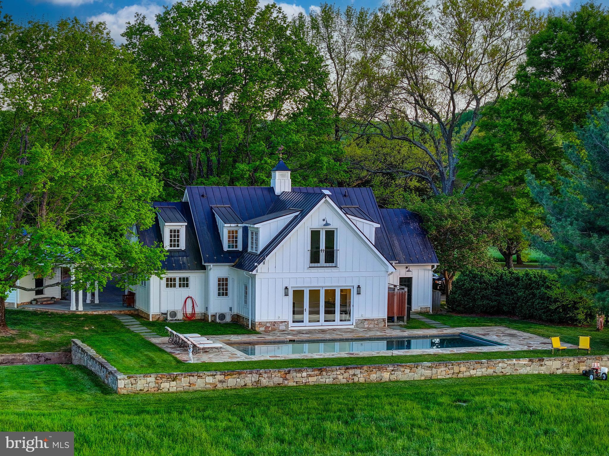 13401 Longnecker Road Reisterstown, MD 21136 - Photo 35 of 58 a view of house with garden and tall trees