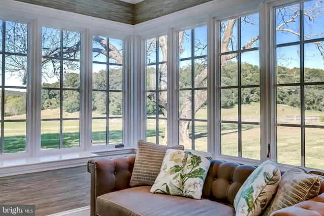 a spacious bedroom with a bed and a fireplace