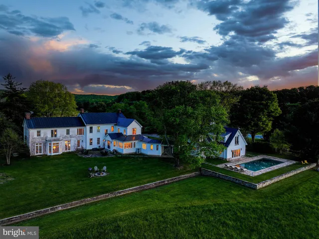 front view of house with yard and entertaining space
