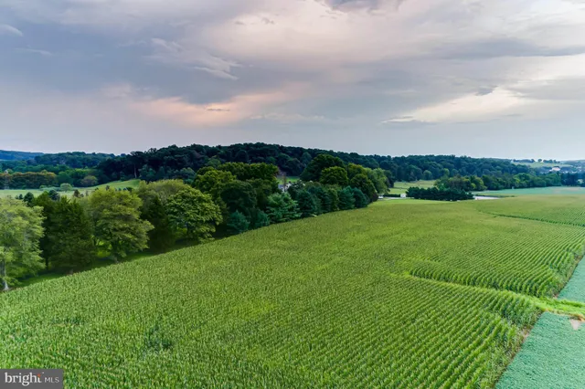 a view of a swimming pool with outdoor seating