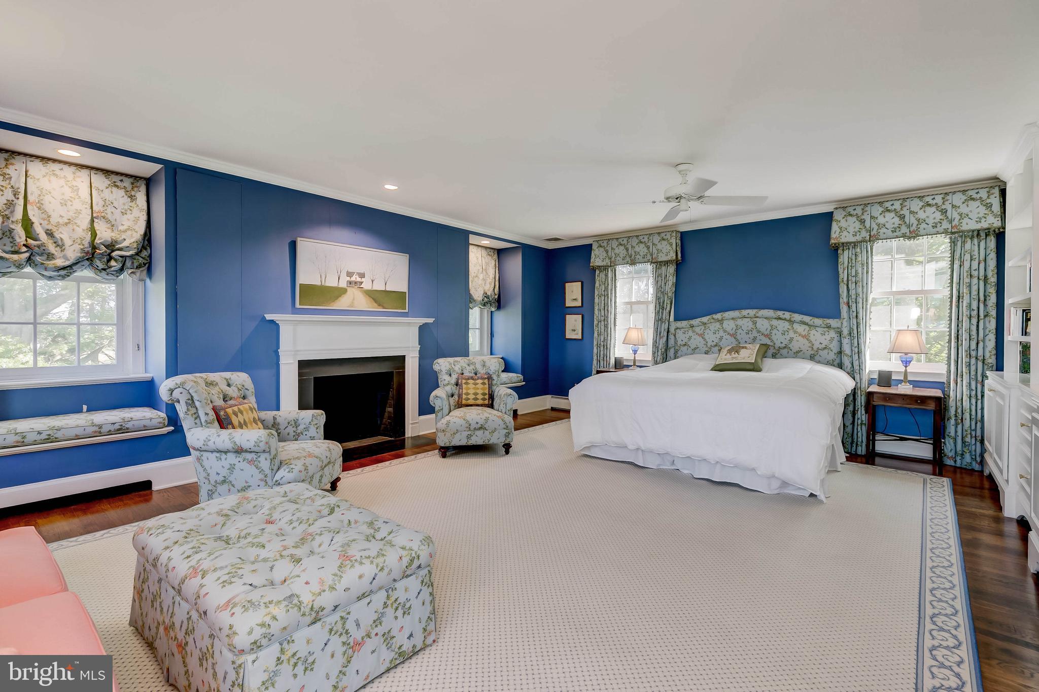 13401 Longnecker Road Reisterstown, MD 21136 - Photo 43 of 58 a spacious bedroom with a bed and a fireplace