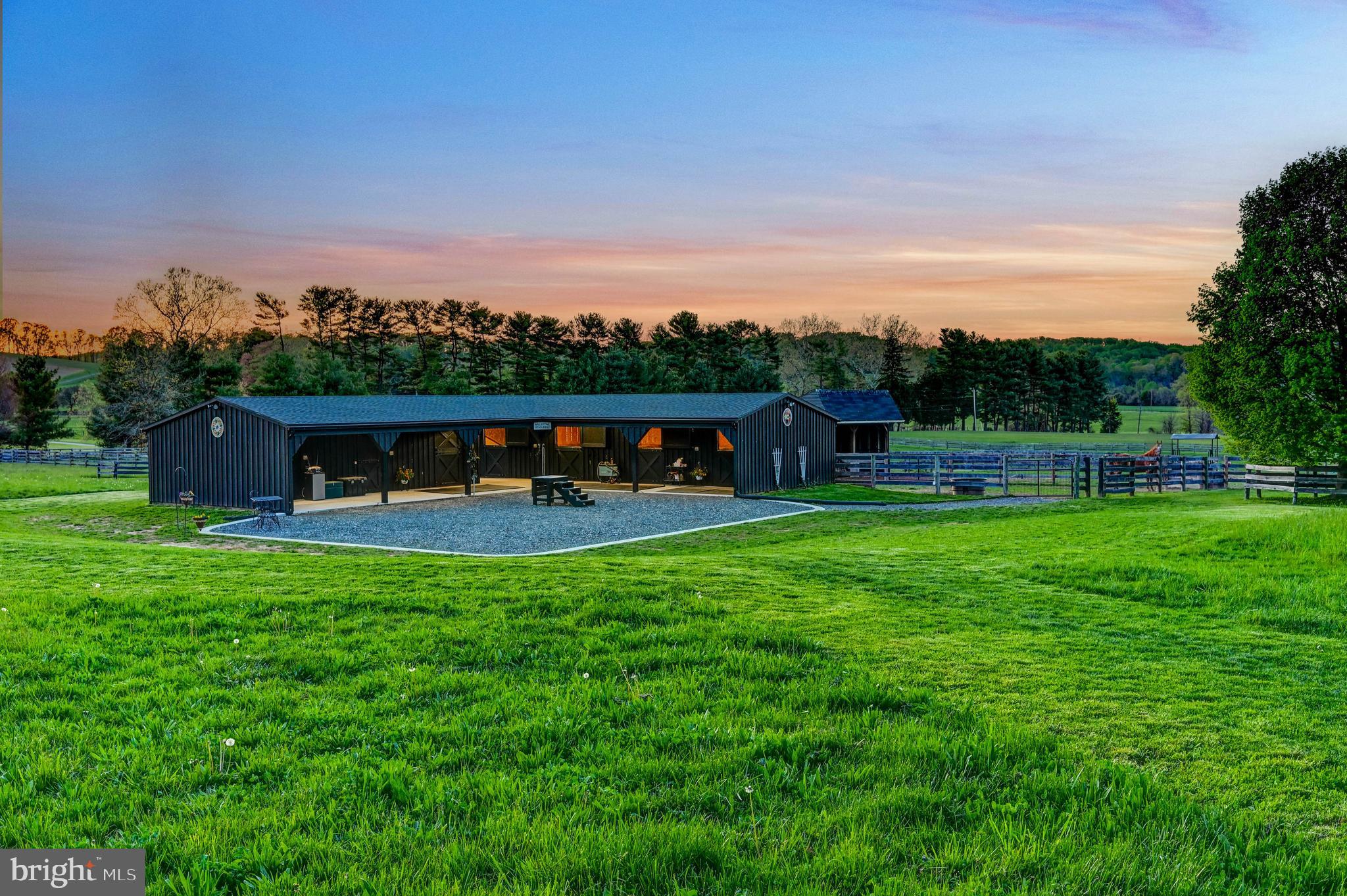 13401 Longnecker Road Reisterstown, MD 21136 - Photo 48 of 58 a view of a big yard with a table and a chairs