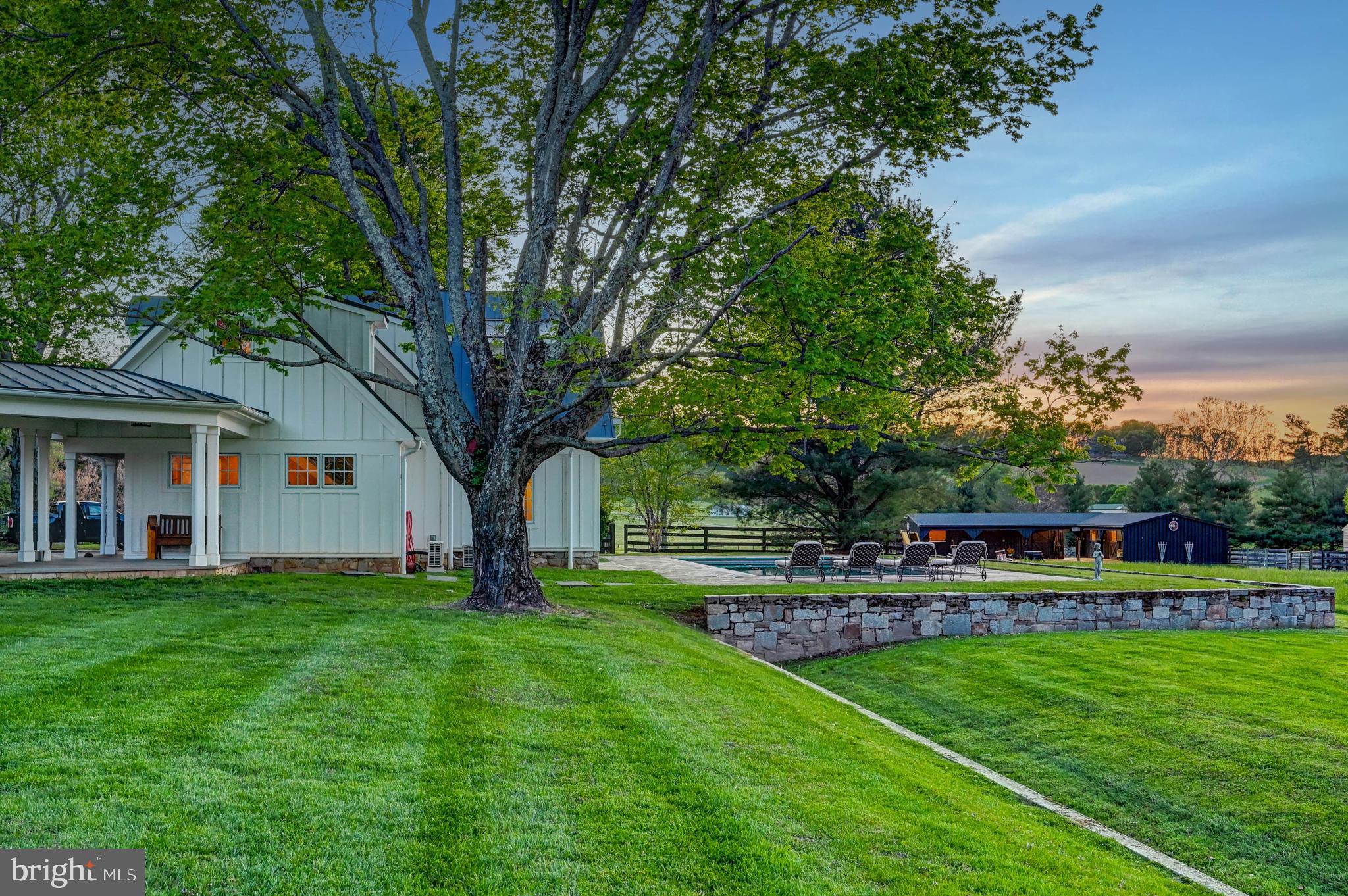 13401 Longnecker Road Reisterstown, MD 21136 - Photo 8 of 58 a view of a house with a big yard and large trees