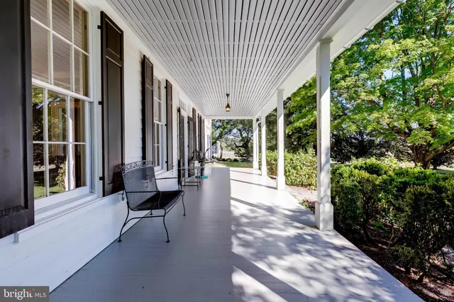 a kitchen with stainless steel appliances granite countertop a stove and a wooden floors
