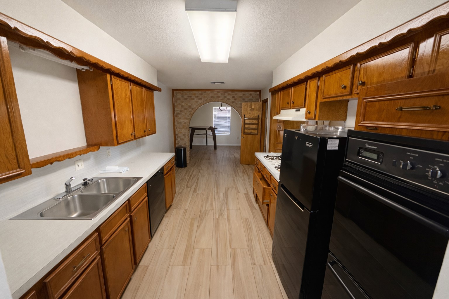 21547 Binford Road Waller, TX 77484 - Photo 15 of 19 a kitchen with a sink and wooden floor