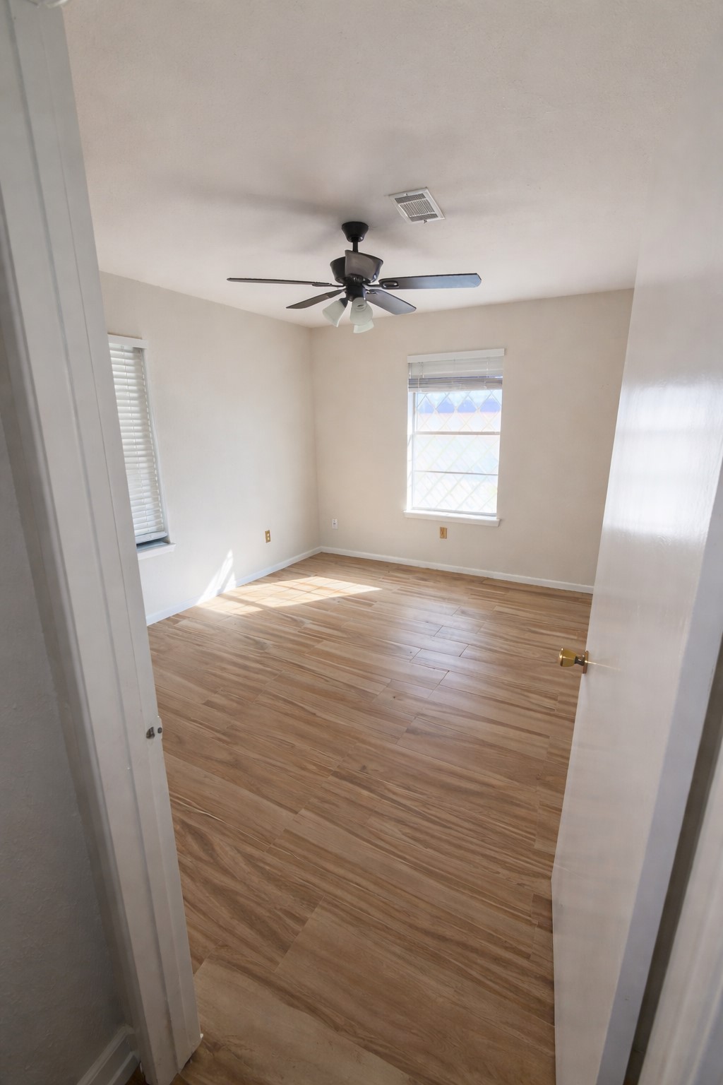 21547 Binford Road Waller, TX 77484 - Photo 7 of 19 wooden floor in an empty room with a window
