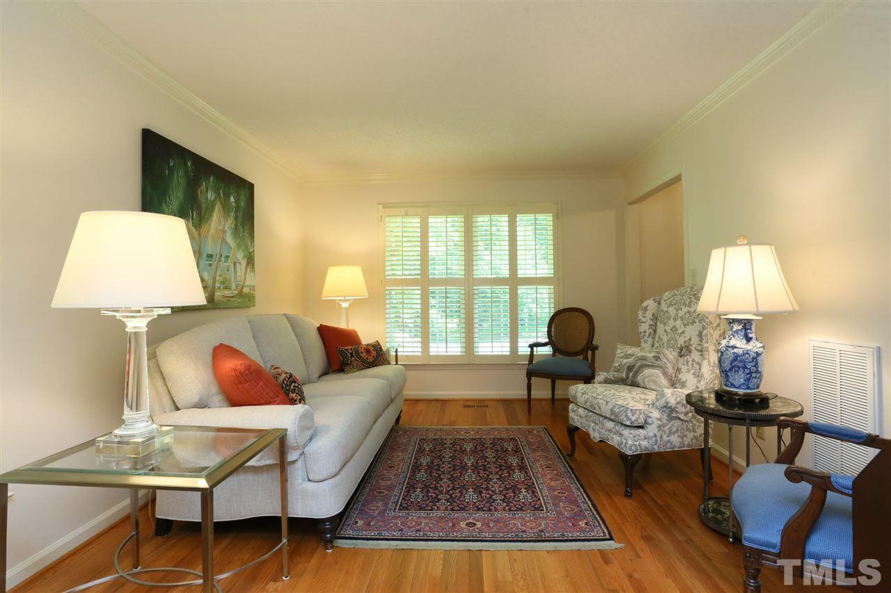 4505 Old Colony Road Raleigh, NC 27613 - Photo 11 of 30 a living room with furniture and a lamp