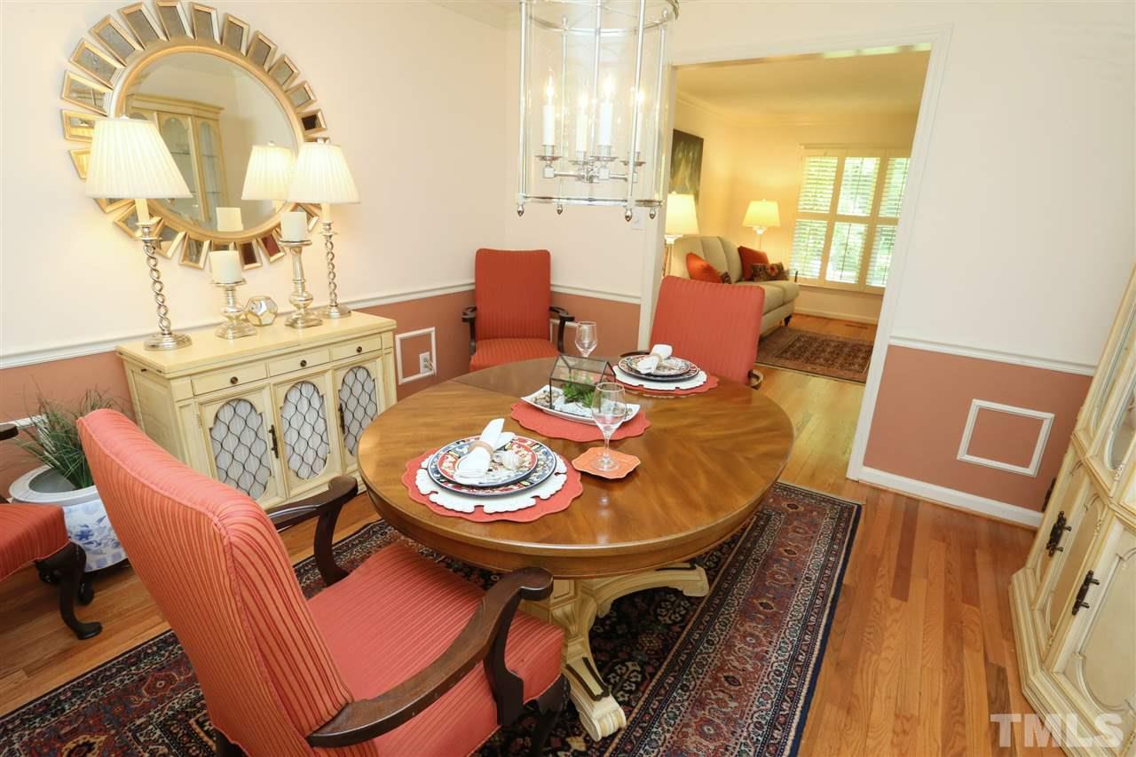 4505 Old Colony Road Raleigh, NC 27613 - Photo 13 of 30 a dining room with furniture a rug and wooden floor