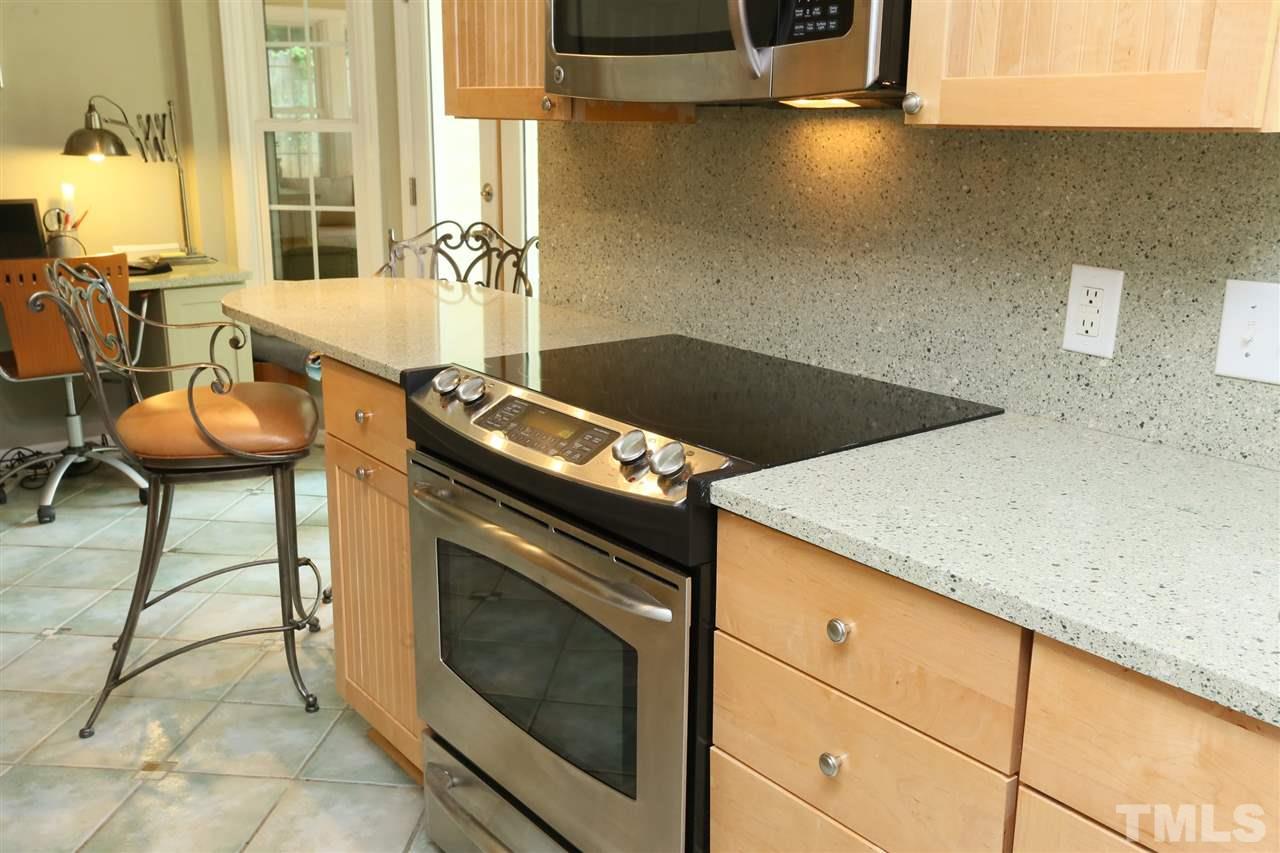 4505 Old Colony Road Raleigh, NC 27613 - Photo 17 of 30 a kitchen with a stove and a microwave