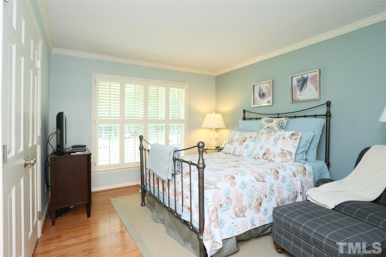 4505 Old Colony Road Raleigh, NC 27613 - Photo 19 of 30 a bedroom with three beds and a window