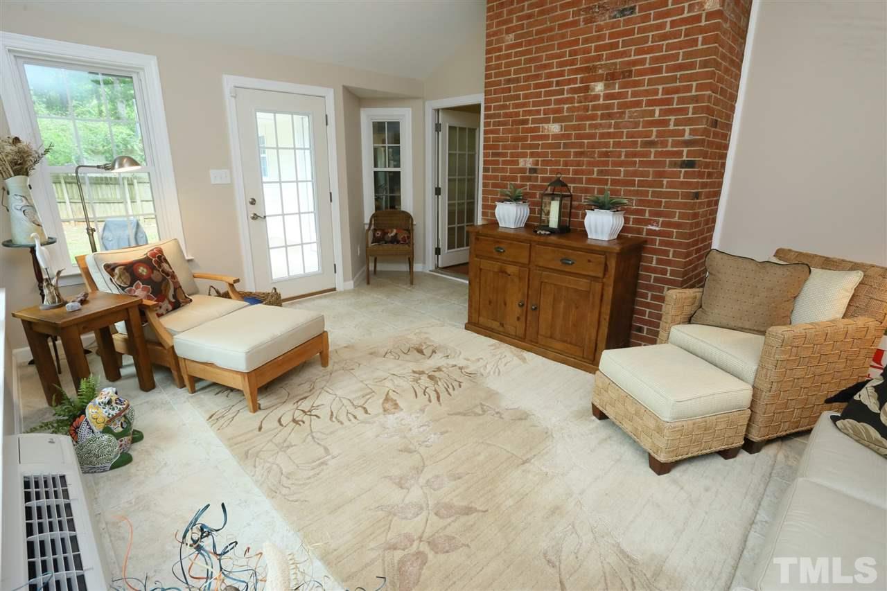4505 Old Colony Road Raleigh, NC 27613 - Photo 22 of 30 a living room with furniture and large windows
