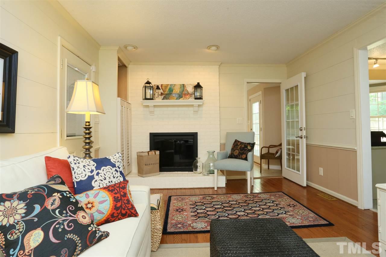 4505 Old Colony Road Raleigh, NC 27613 - Photo 23 of 30 a living room with furniture and a fireplace
