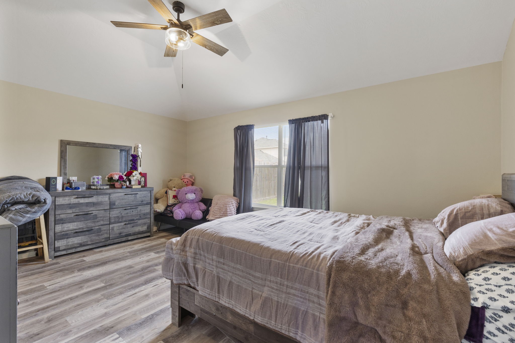 29106 Foxingham Circle Spring, TX 77386 - Photo 22 of 47 a bedroom with a bed and wooden floor