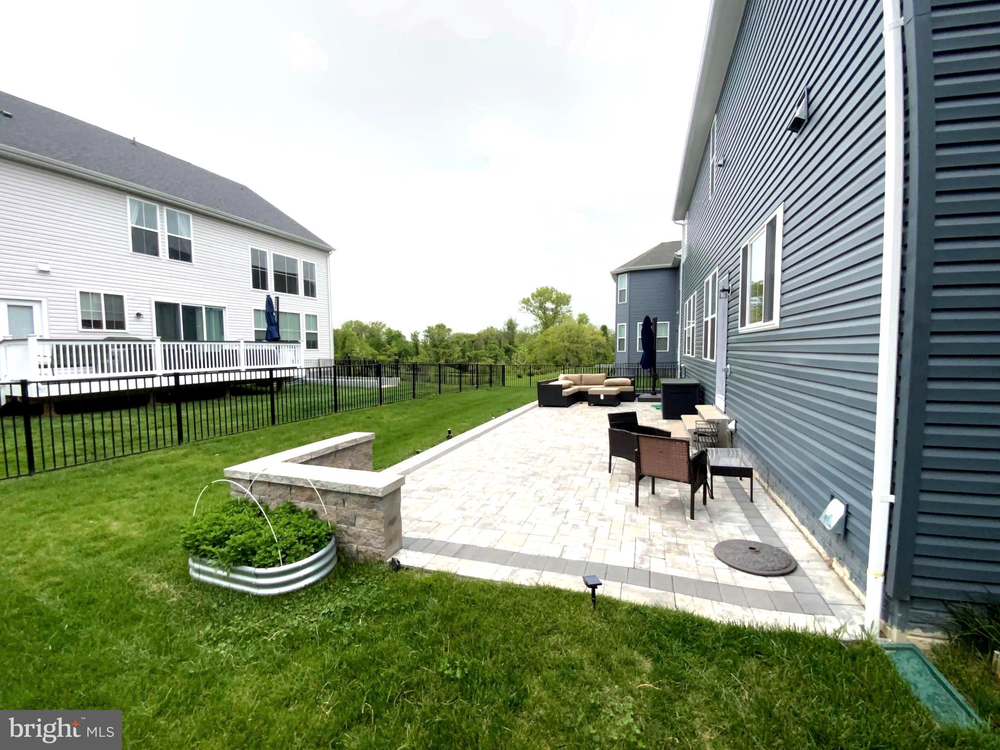 5763 Hawk Ridge Road Frederick, MD 21704 - Photo 38 of 73 a view of a house with backyard sitting area and garden