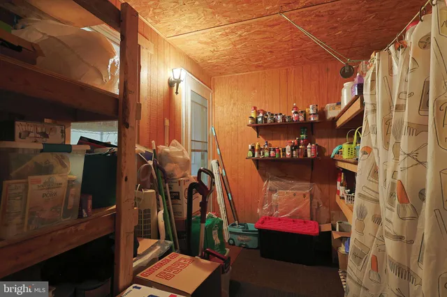 a bedroom with a bed and a lamp