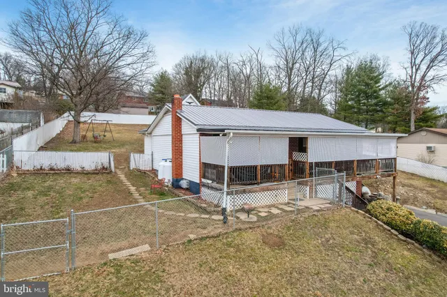 a balcony with furniture and wooden floor