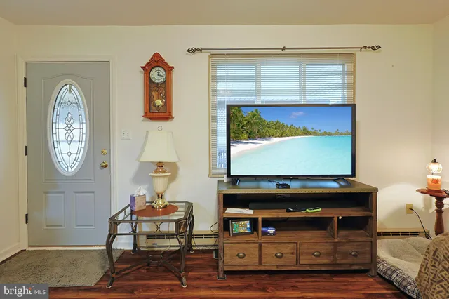 a kitchen with white cabinets and appliances