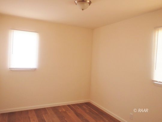 437 North Fairview Street Ridgecrest, CA 93555 - Photo 27 of 35 a view of a small space with wooden floor and a window