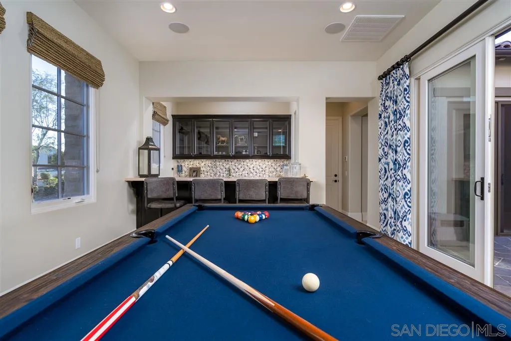 8920 Via Rancho Cielo Rancho Santa Fe, CA 92067 - Photo 13 of 25 a living room with furniture pool table and a flat screen tv
