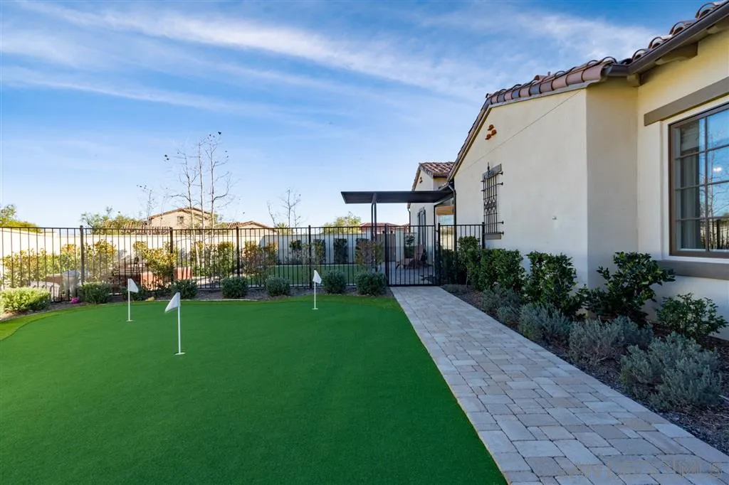 8920 Via Rancho Cielo Rancho Santa Fe, CA 92067 - Photo 18 of 25 a view of a house with backyard