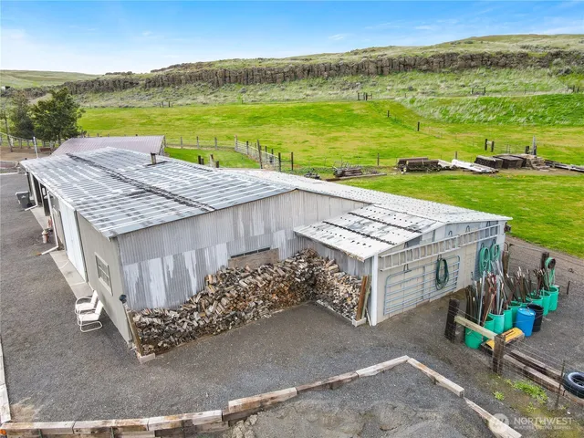 a view of a house with pool and a garden