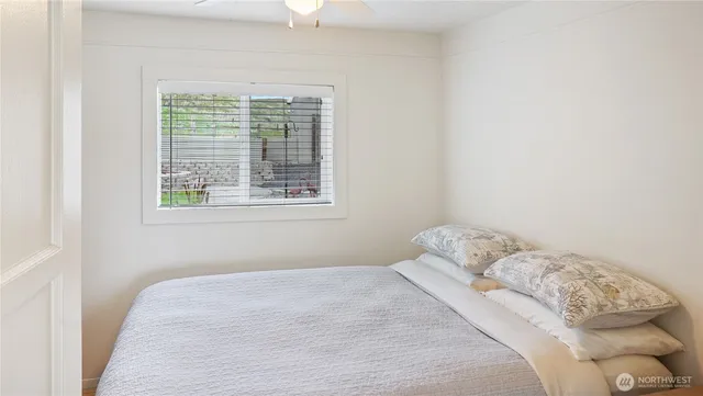 a view of walk in closet with clothes