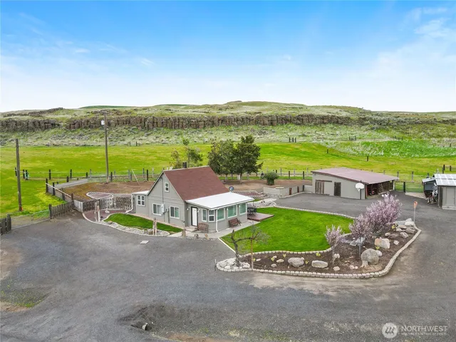 an outdoor space with furniture and garden