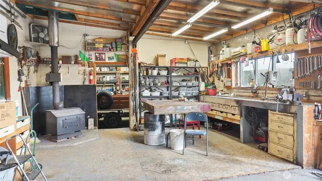 a room with lots of wooden furniture and a water heater