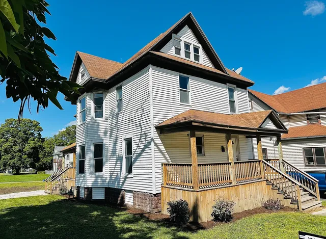 a front view of a house with a yard