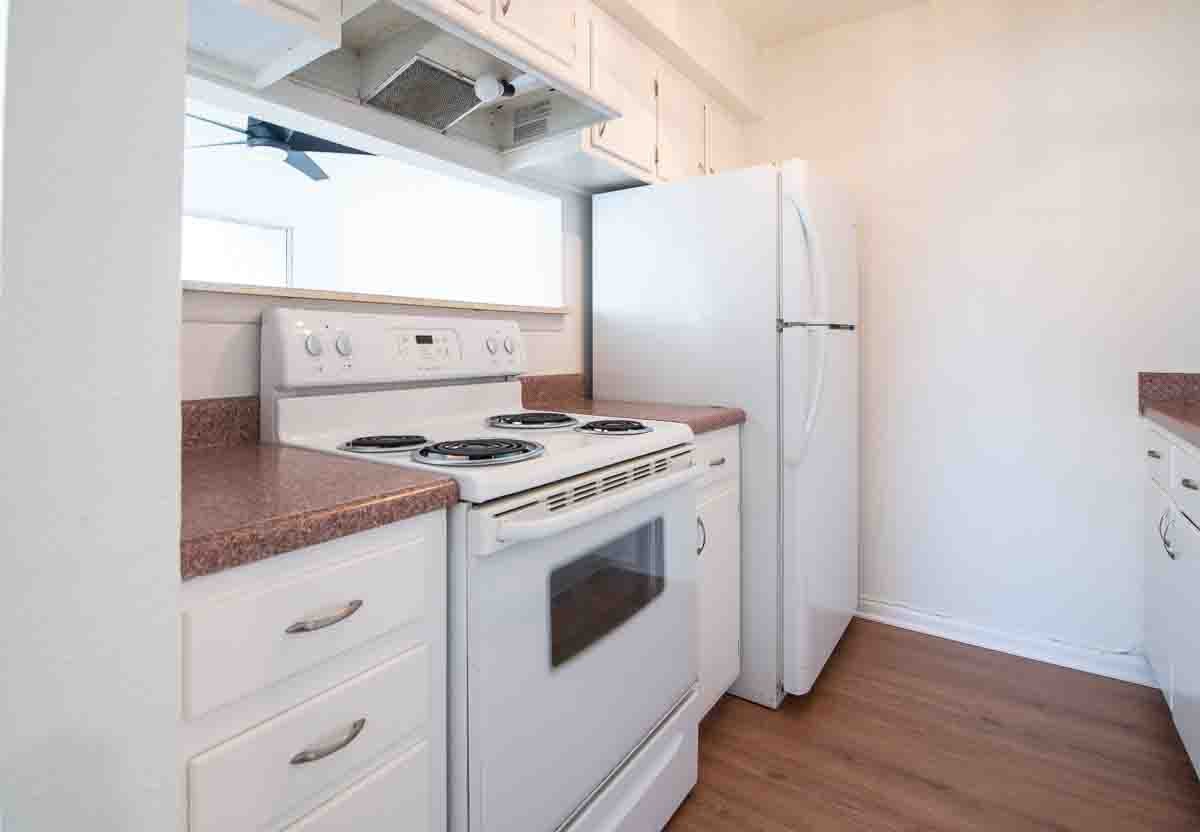 810 Bellevue Road, Unit 290 Nashville, TN 37221 - Photo 21 of 38 a kitchen with granite countertop a white stove and refrigerator
