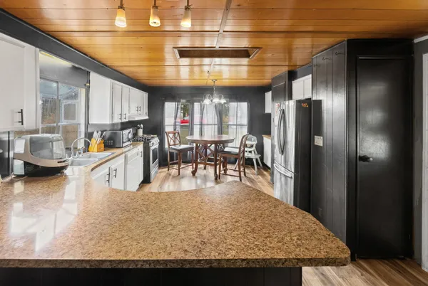 a view of a dining room with furniture window and outside view