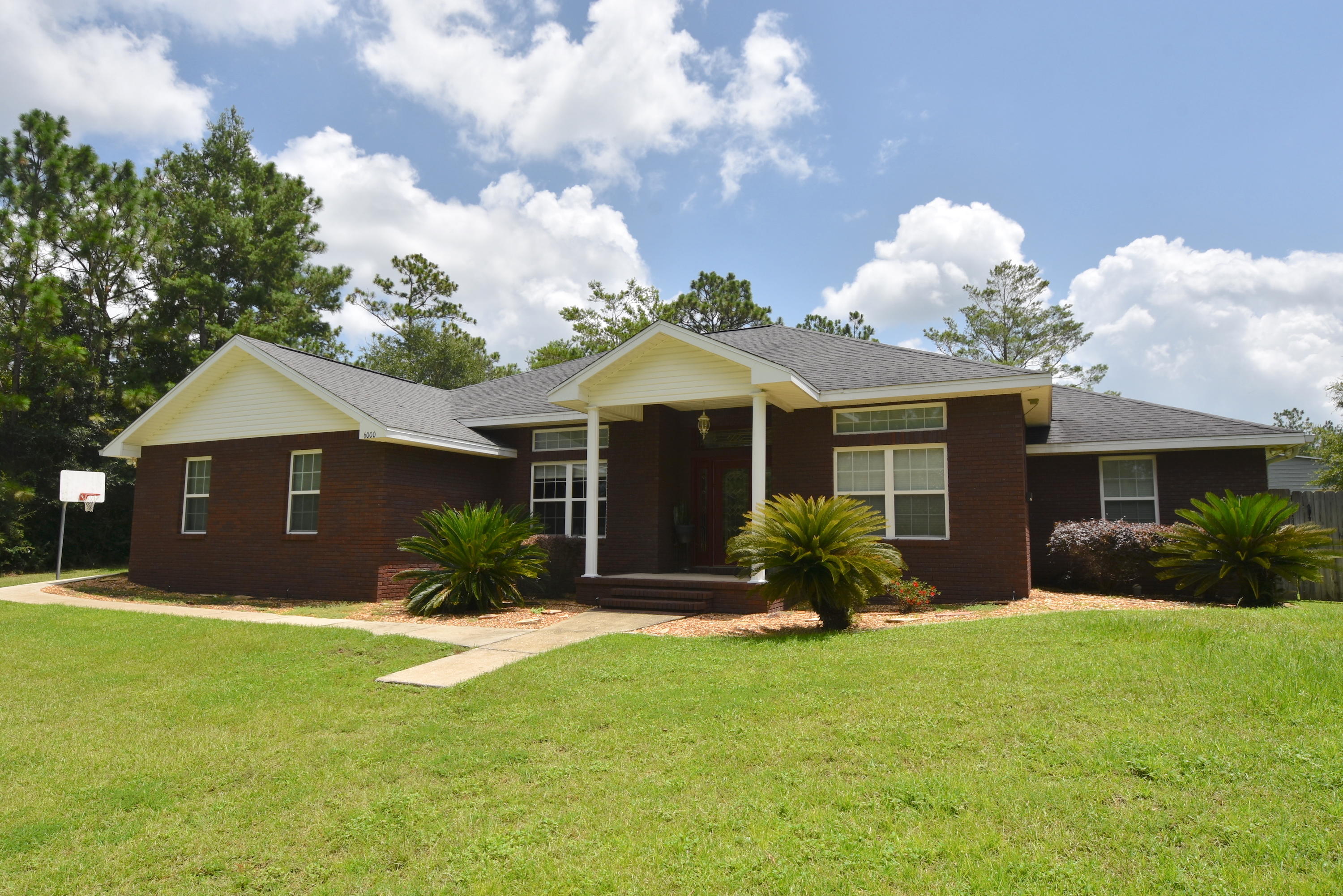 6000 Gagnon Road Crestview, FL 32539 - Photo 1 of 51 a front view of a house with garden