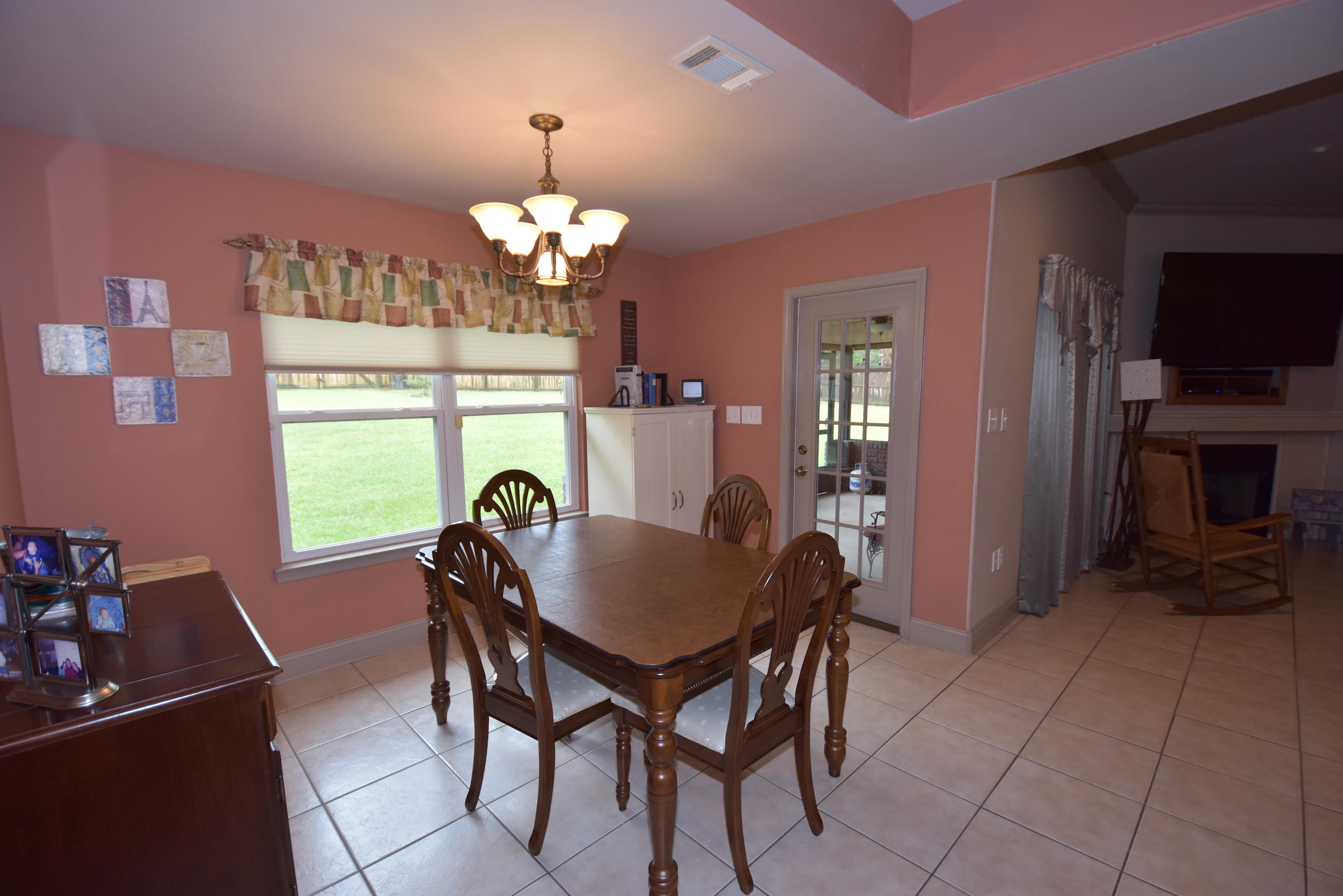 6000 Gagnon Road Crestview, FL 32539 - Photo 12 of 51 a view of a dining room with furniture and chandelier