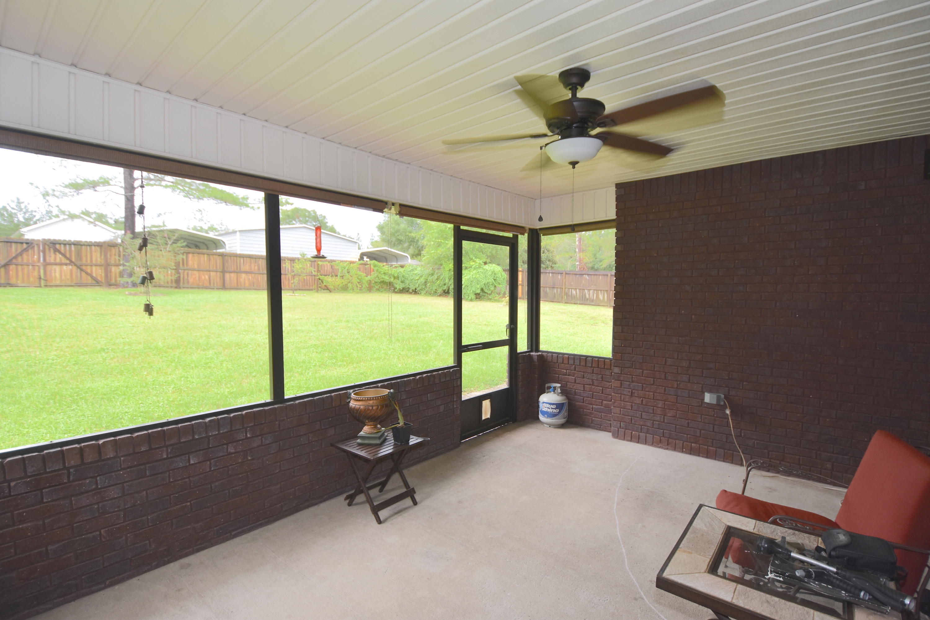 6000 Gagnon Road Crestview, FL 32539 - Photo 18 of 51 a room with pool table and a floor to ceiling window