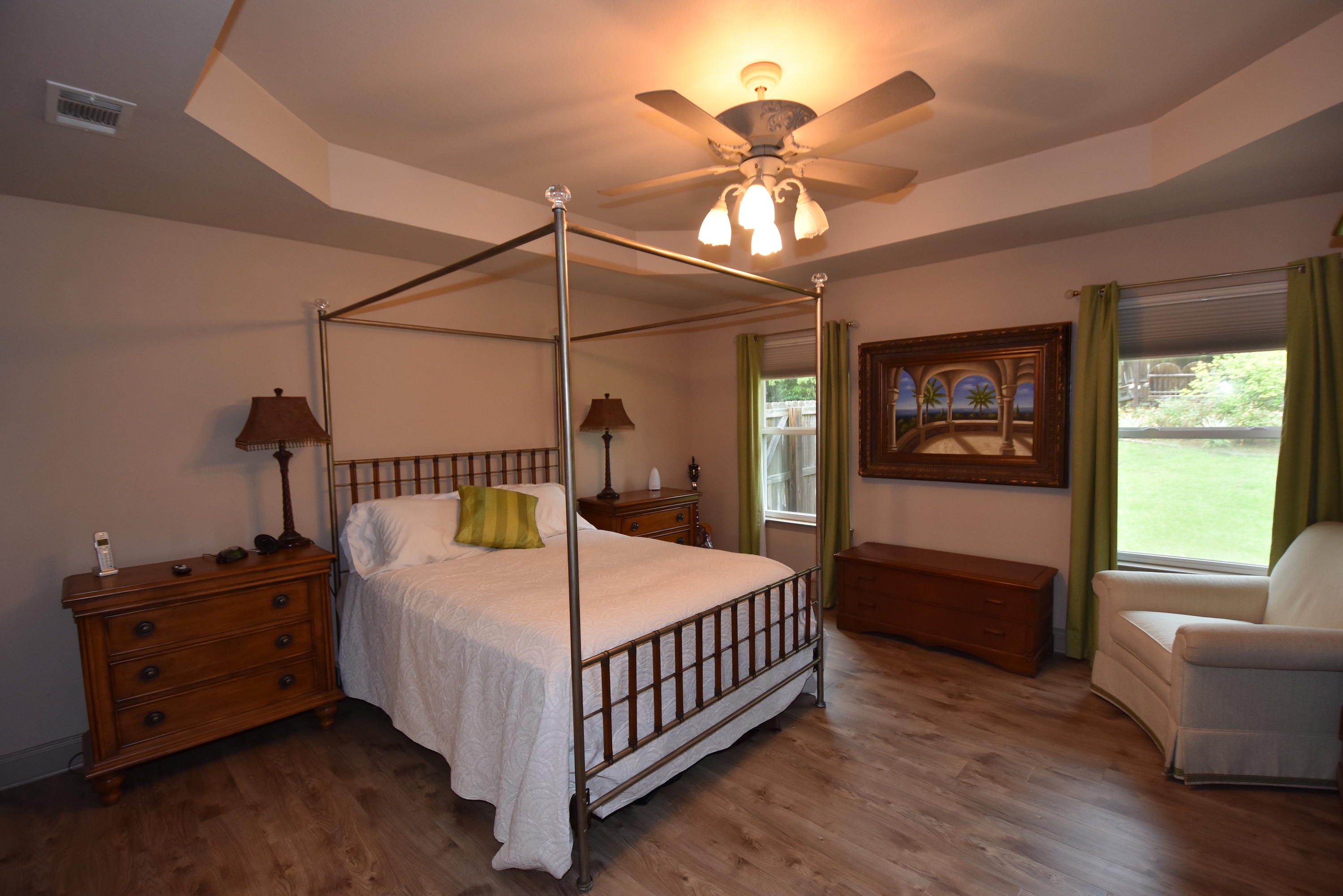 6000 Gagnon Road Crestview, FL 32539 - Photo 19 of 51 a bedroom with a bed and a chandelier