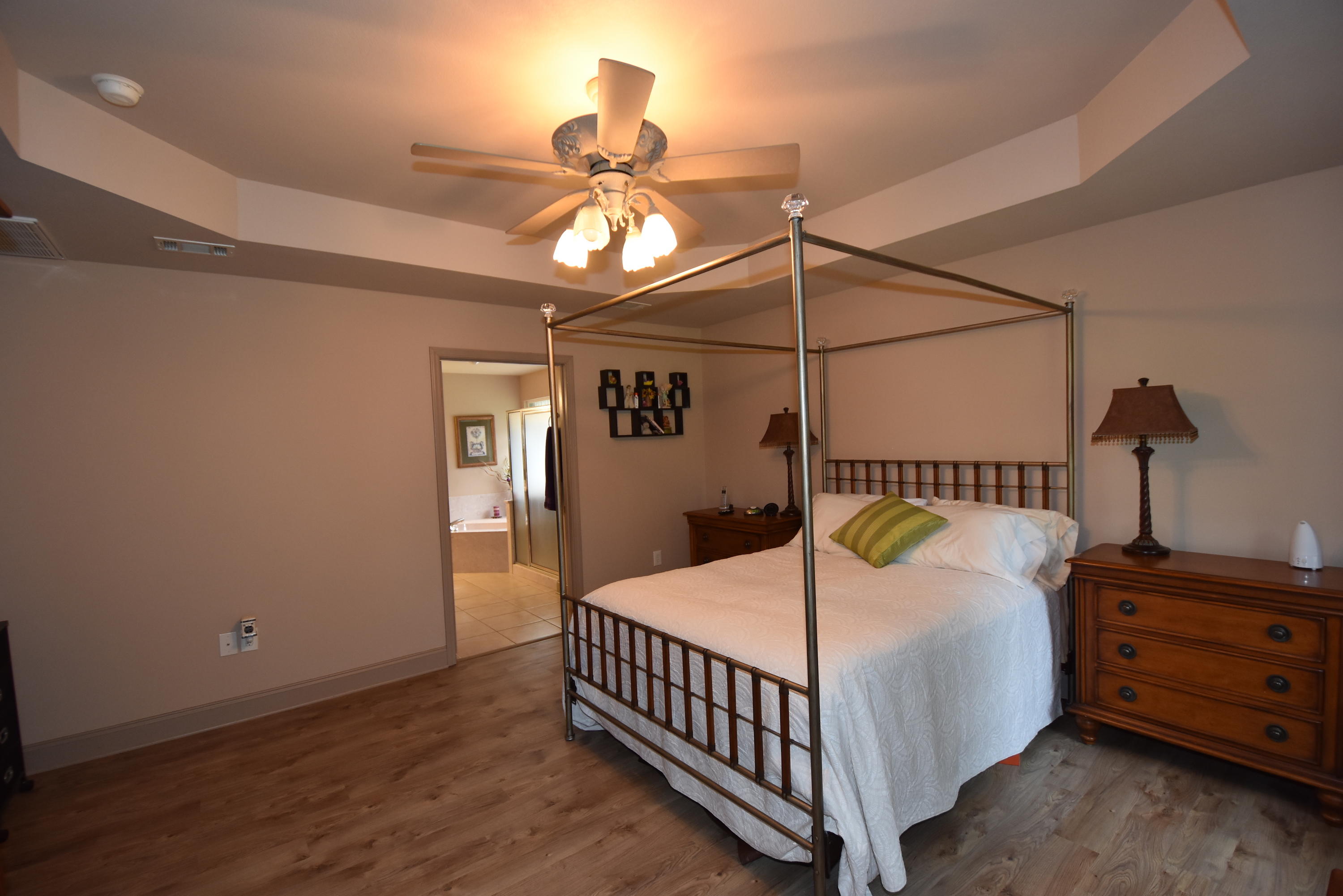 6000 Gagnon Road Crestview, FL 32539 - Photo 21 of 51 a bedroom with a bed and wooden floor