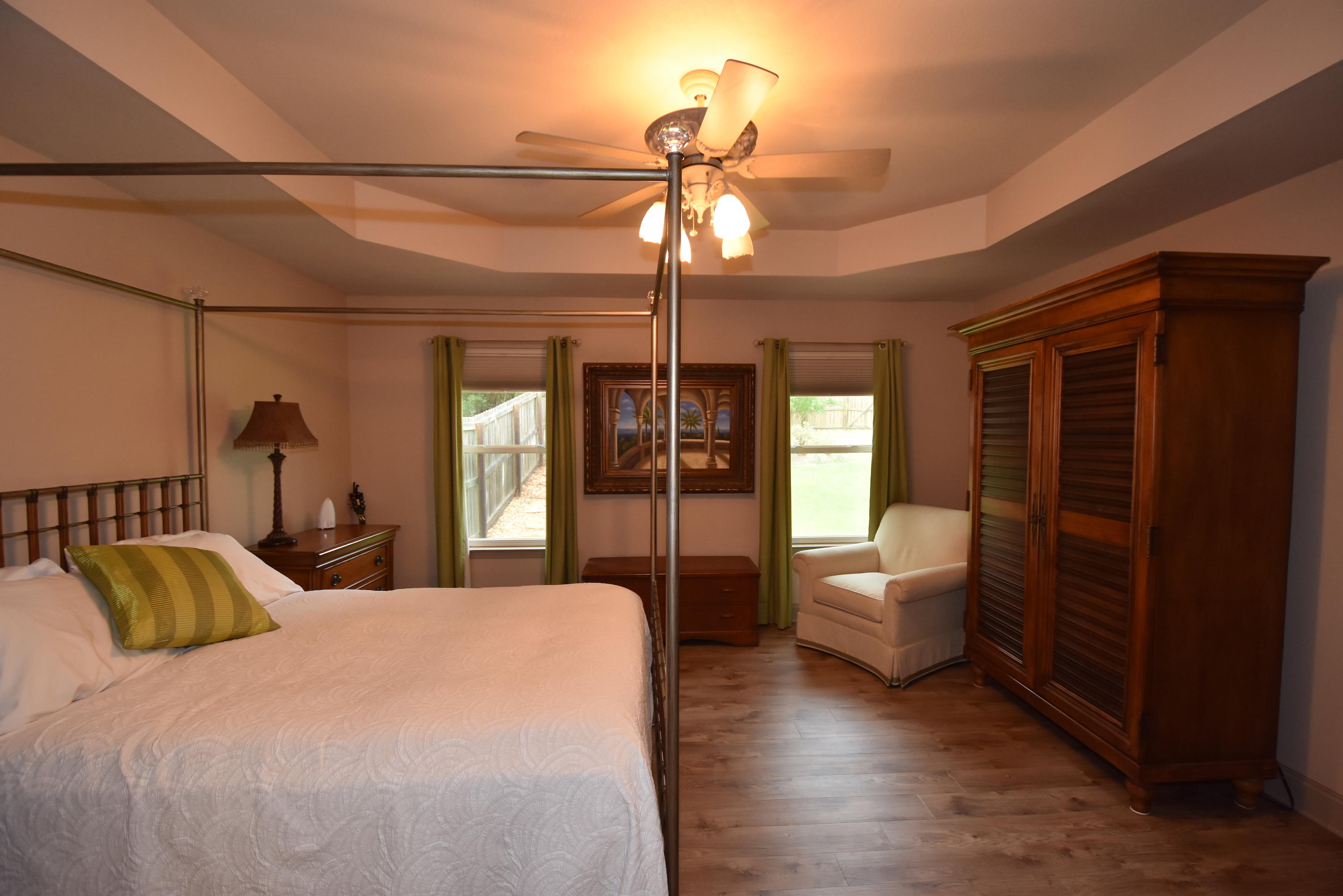 6000 Gagnon Road Crestview, FL 32539 - Photo 22 of 51 a bedroom with a bed and wooden floor