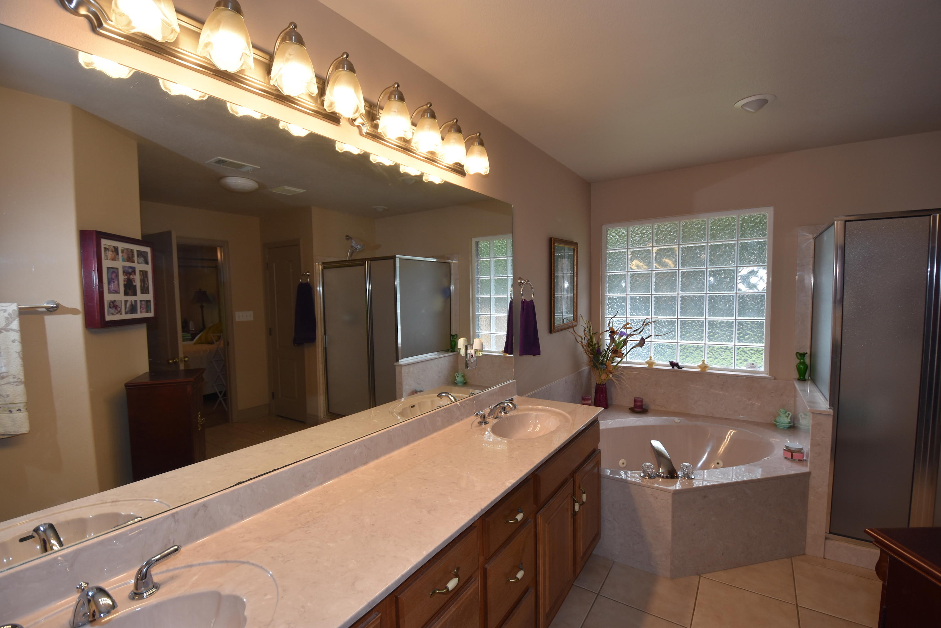 6000 Gagnon Road Crestview, FL 32539 - Photo 24 of 51 a spacious bathroom with a bathtub shower and sink