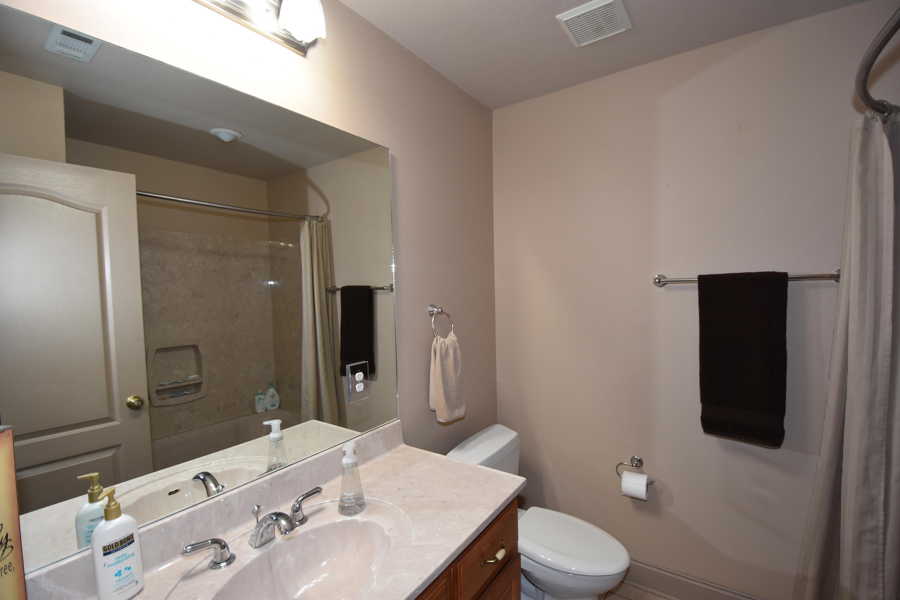 6000 Gagnon Road Crestview, FL 32539 - Photo 27 of 51 a bathroom with a sink and a mirror