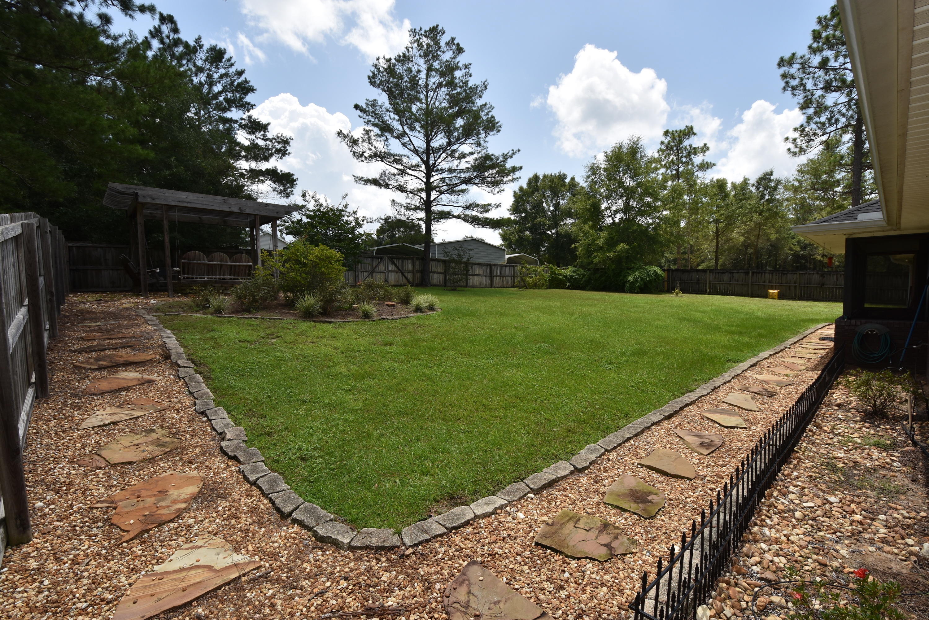6000 Gagnon Road Crestview, FL 32539 - Photo 30 of 51 a view of a backyard with a garden