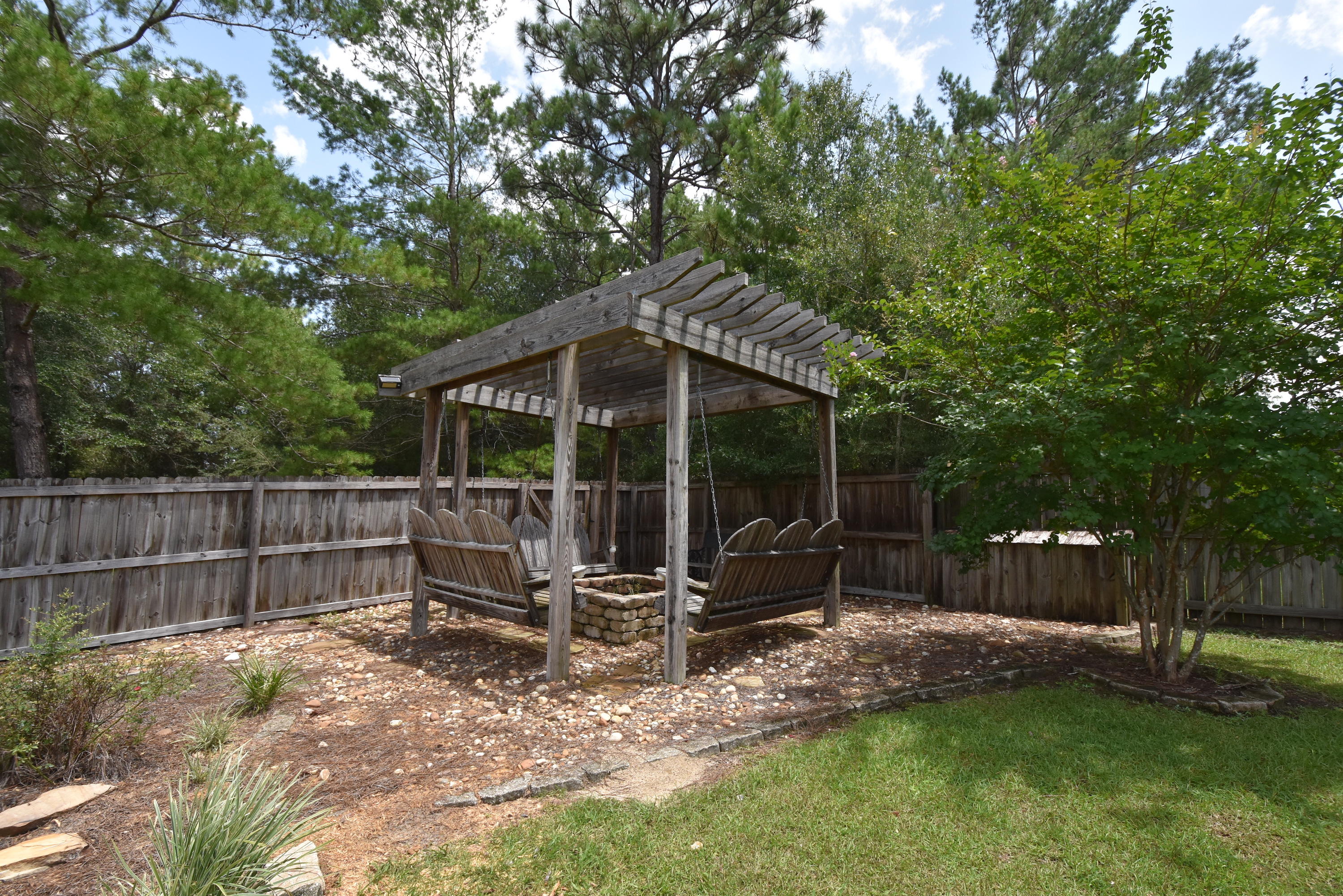 6000 Gagnon Road Crestview, FL 32539 - Photo 31 of 51 a view of a chair and table in backyard