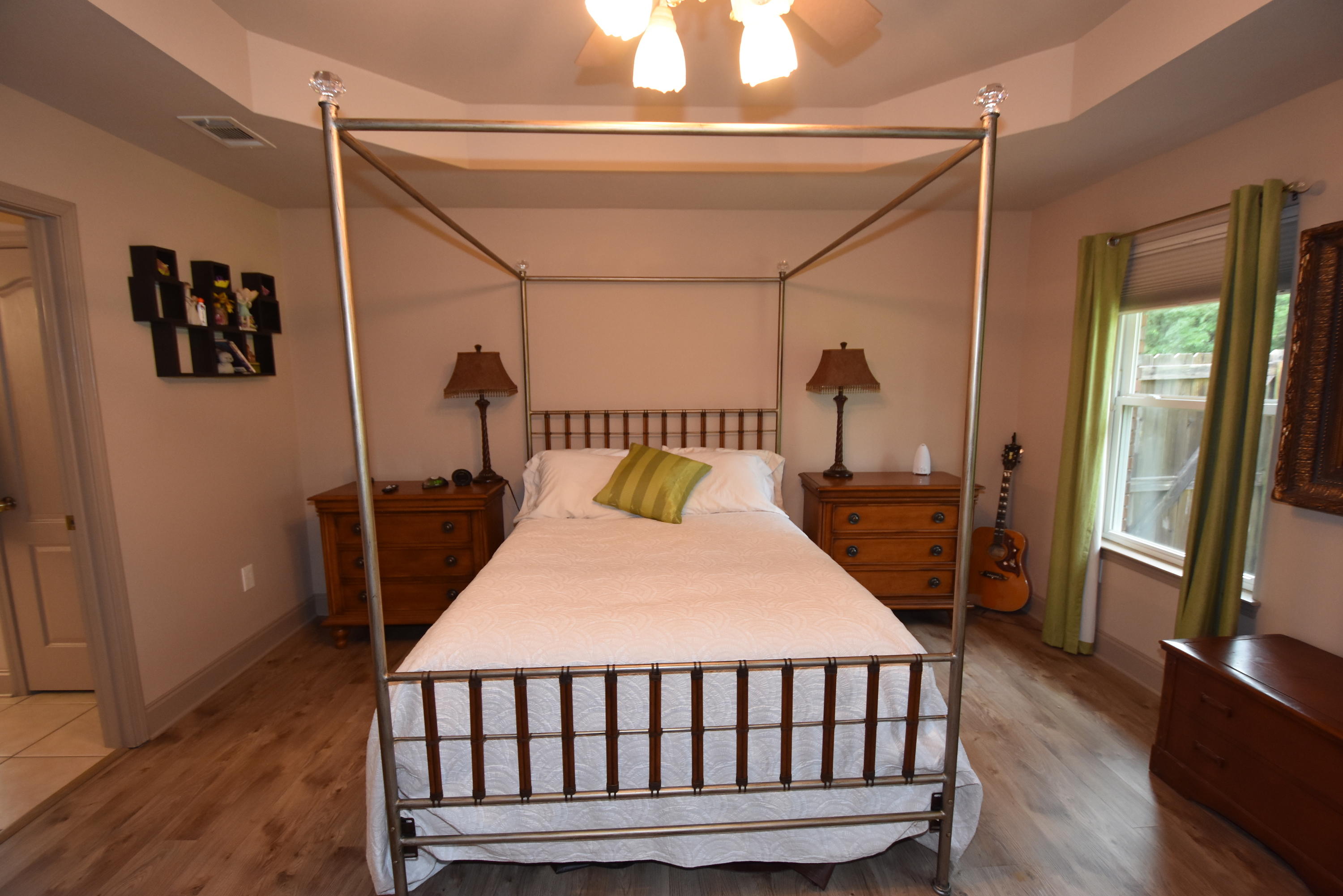 6000 Gagnon Road Crestview, FL 32539 - Photo 39 of 51 a bedroom with a bed and wooden floor