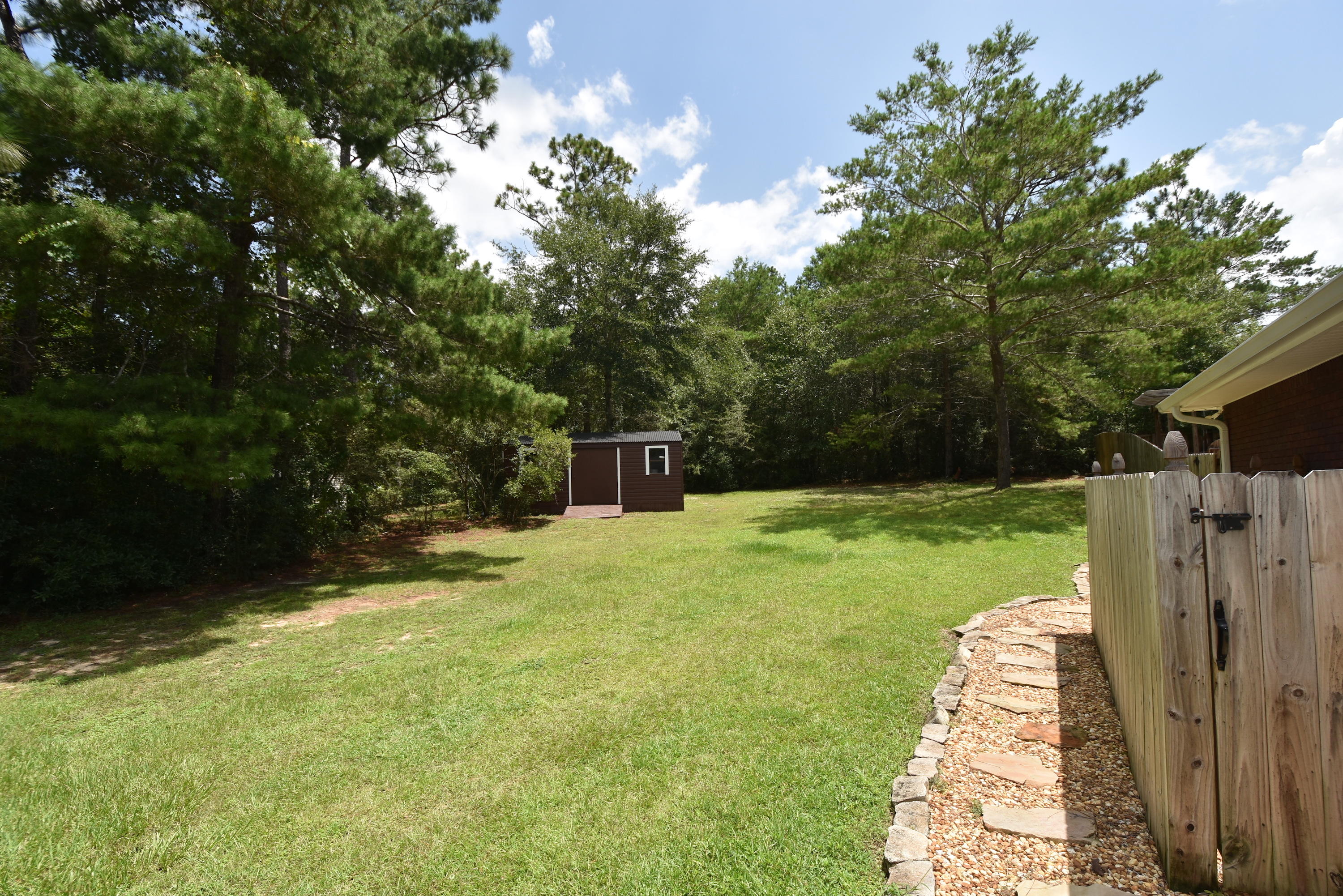 6000 Gagnon Road Crestview, FL 32539 - Photo 44 of 51 a view of a backyard with large trees