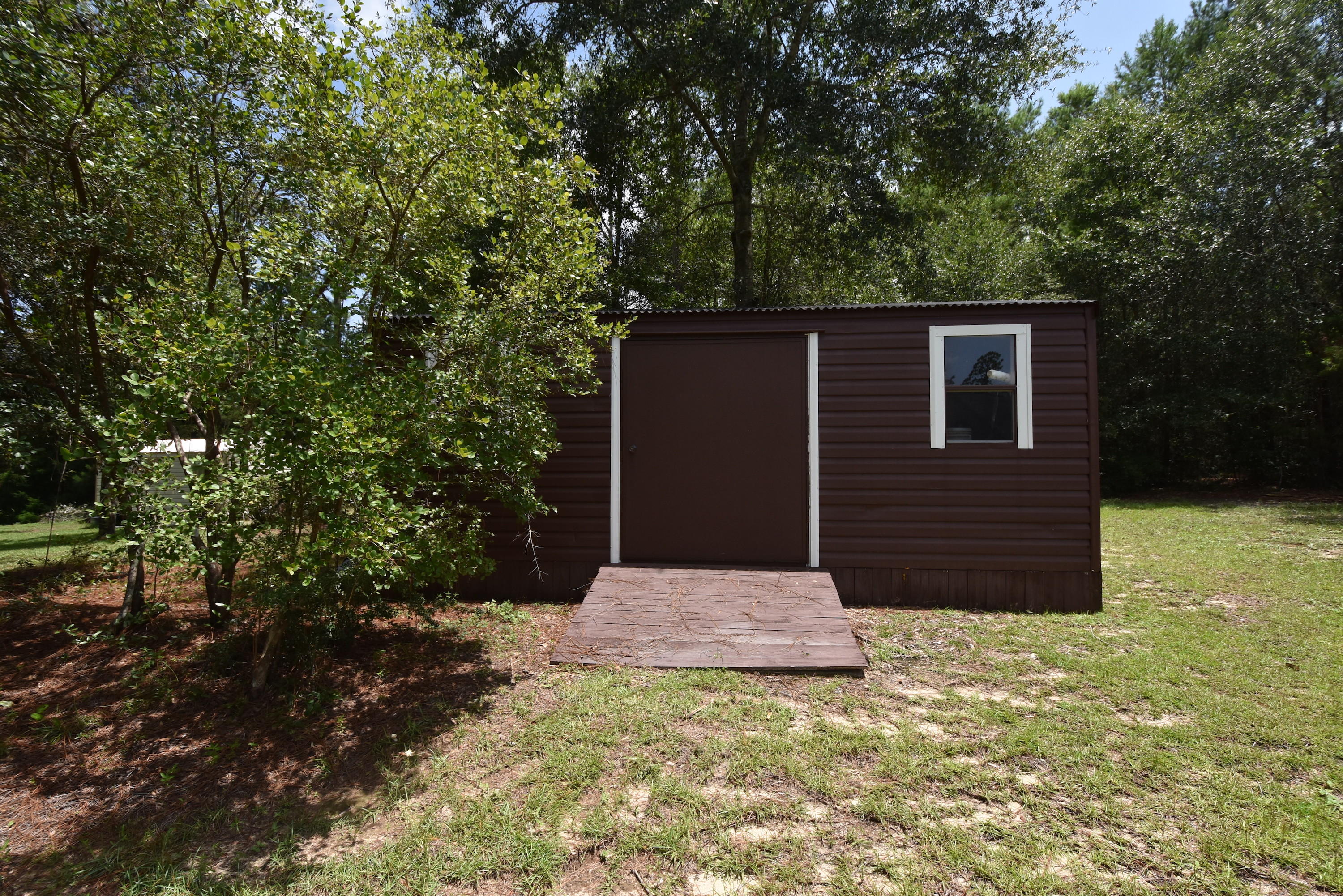 6000 Gagnon Road Crestview, FL 32539 - Photo 45 of 51 a house with trees in front of it