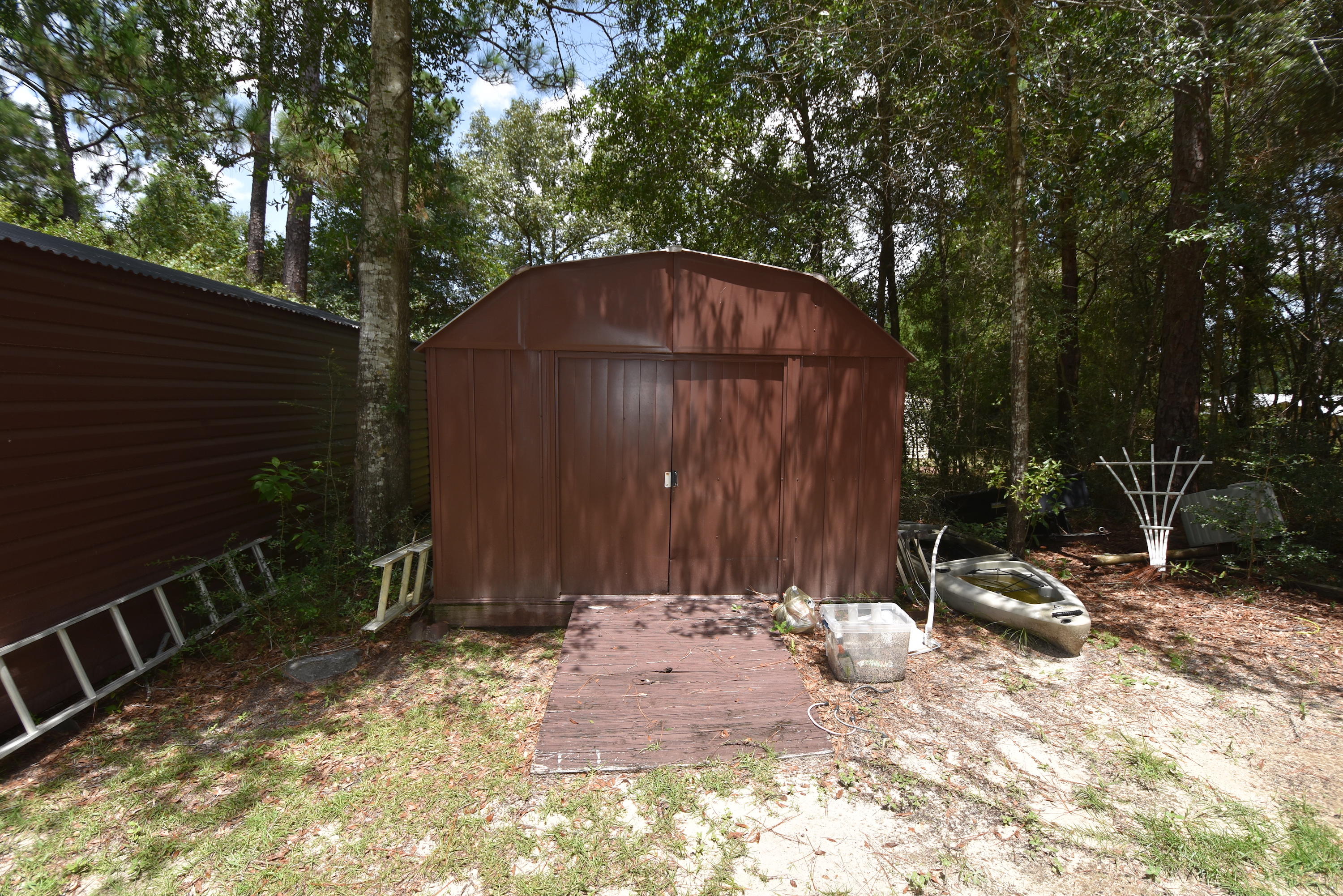 6000 Gagnon Road Crestview, FL 32539 - Photo 46 of 51 a backyard of a house with chairs and wooden fence