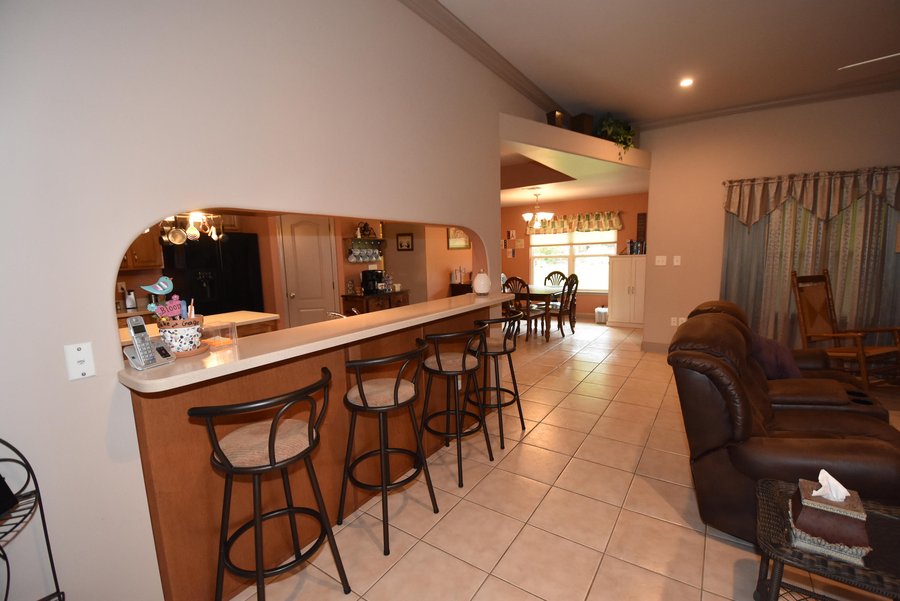 6000 Gagnon Road Crestview, FL 32539 - Photo 7 of 51 a dining hall with couches a flat tv screen and chairs